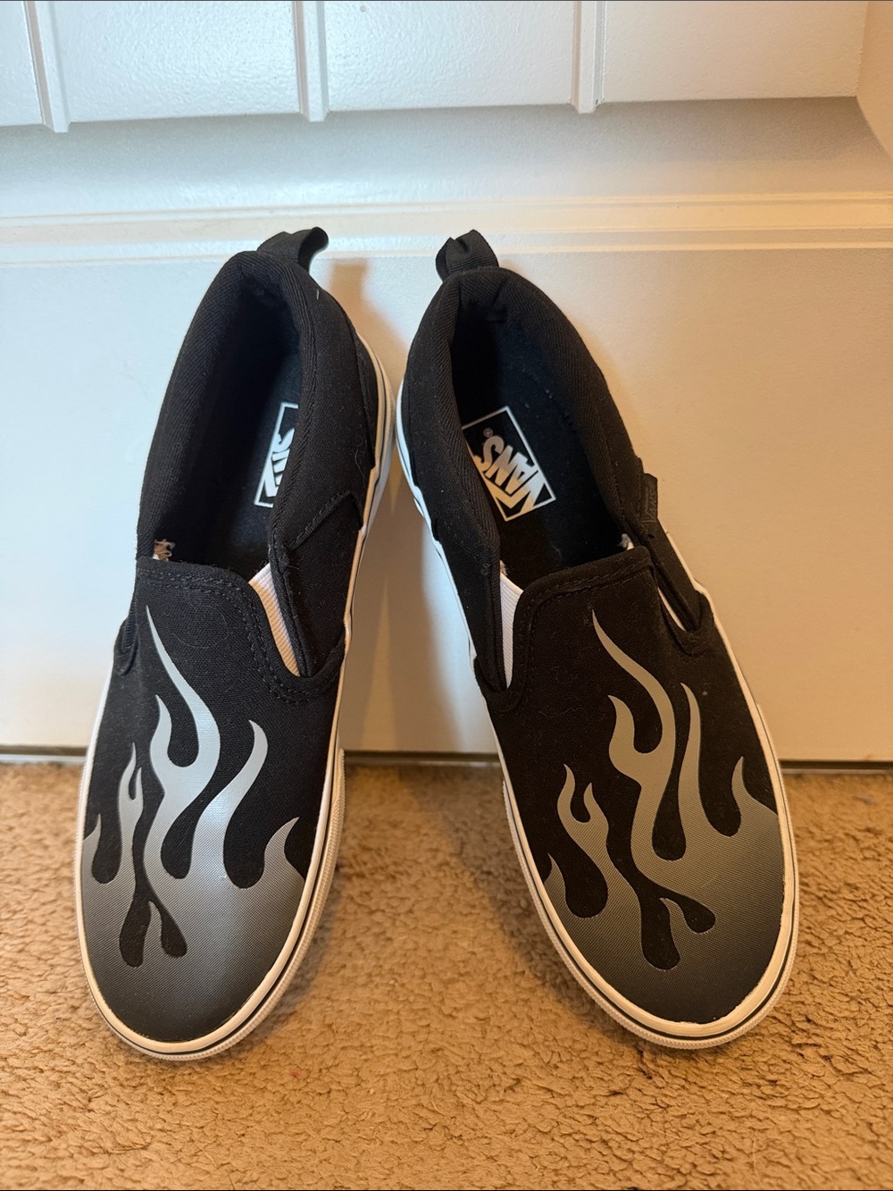 Vans Black Slip-On Canvas Sneakers with Silver Flame Graphic